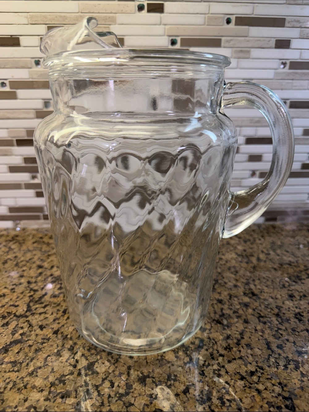 Vintage clear glass pitcher with swirl pattern & built in ice lip